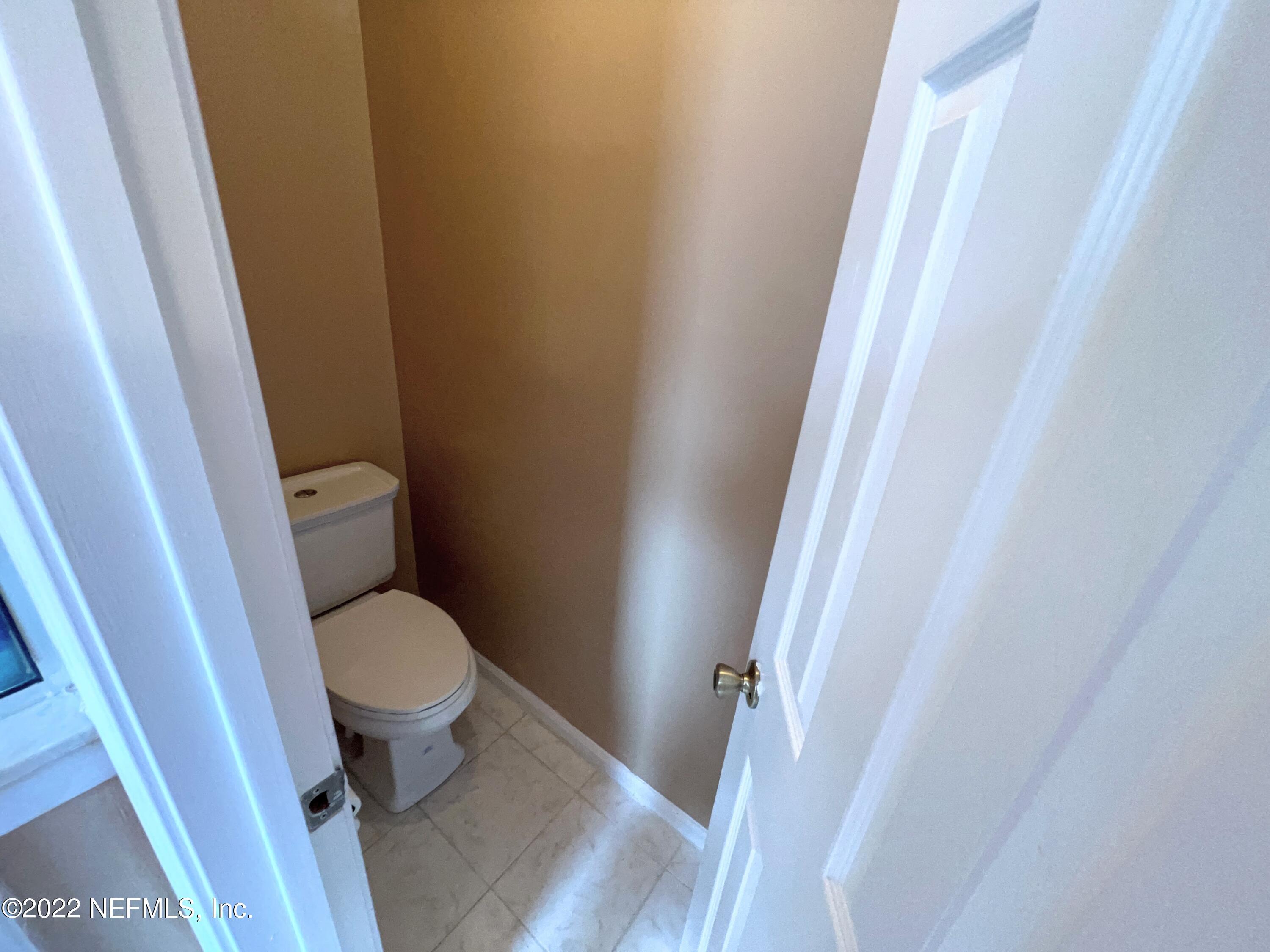 3742 Star Leaf Road West Jacksonville, FL 32210 - Photo 24 of 39 a white toilet sitting next to a sink