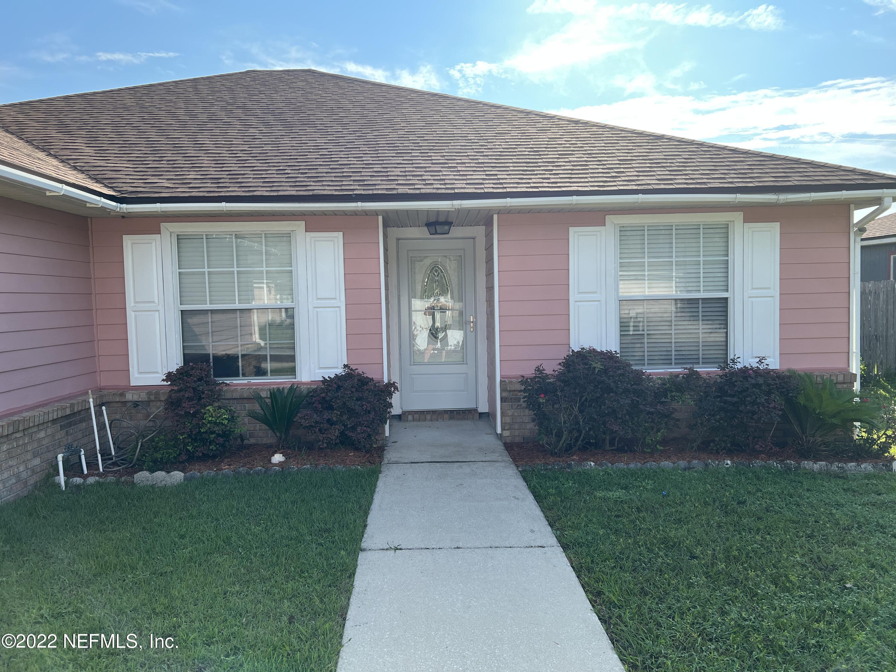 3742 Star Leaf Road West Jacksonville, FL 32210 - Photo 3 of 39 a front view of a house with garden