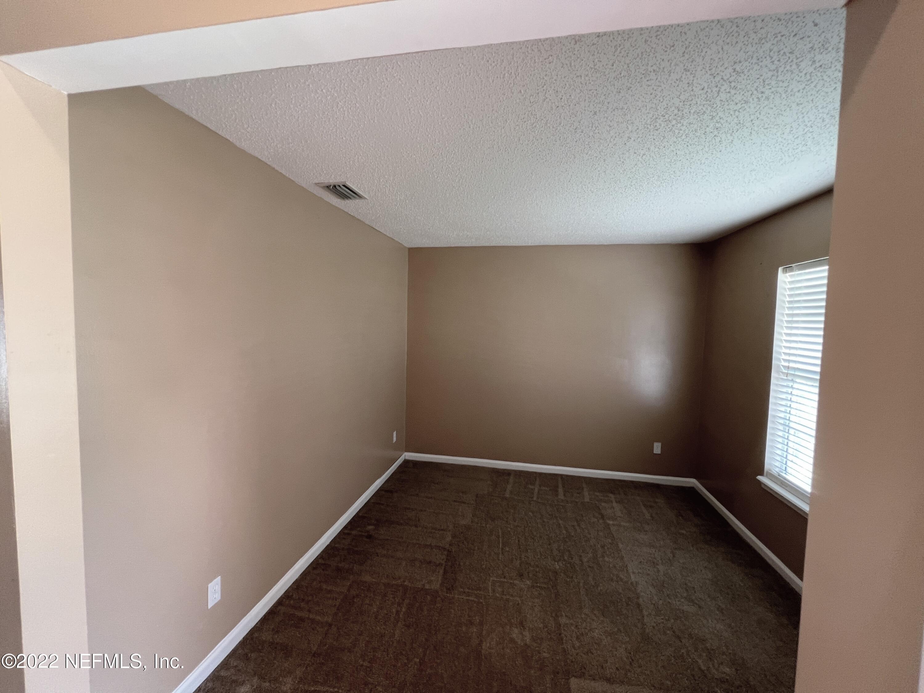 3742 Star Leaf Road West Jacksonville, FL 32210 - Photo 6 of 39 an empty room with a window