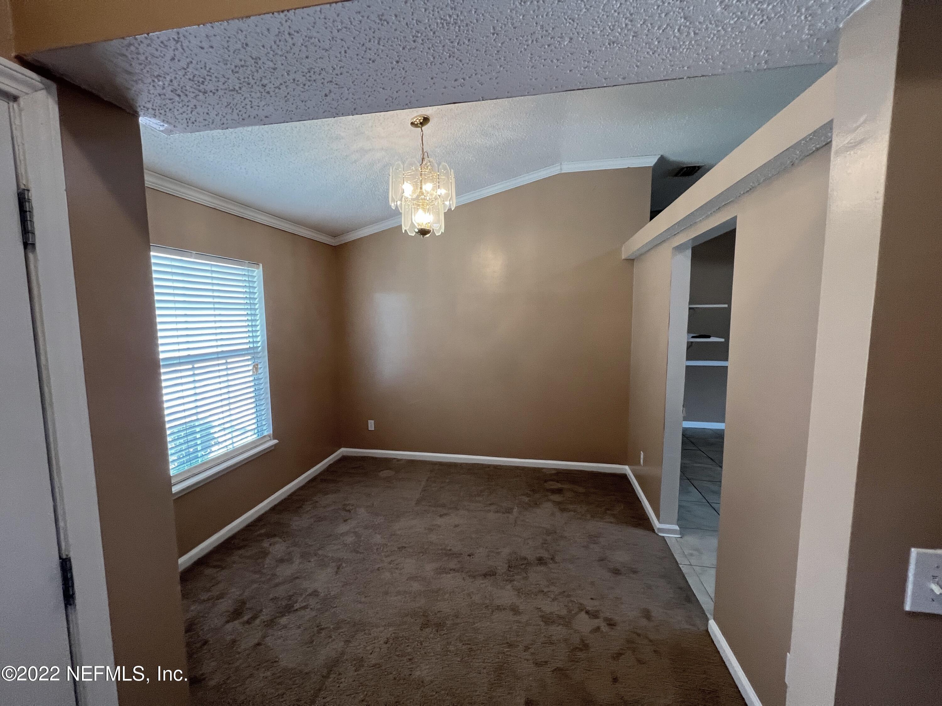 3742 Star Leaf Road West Jacksonville, FL 32210 - Photo 7 of 39 an empty room with windows