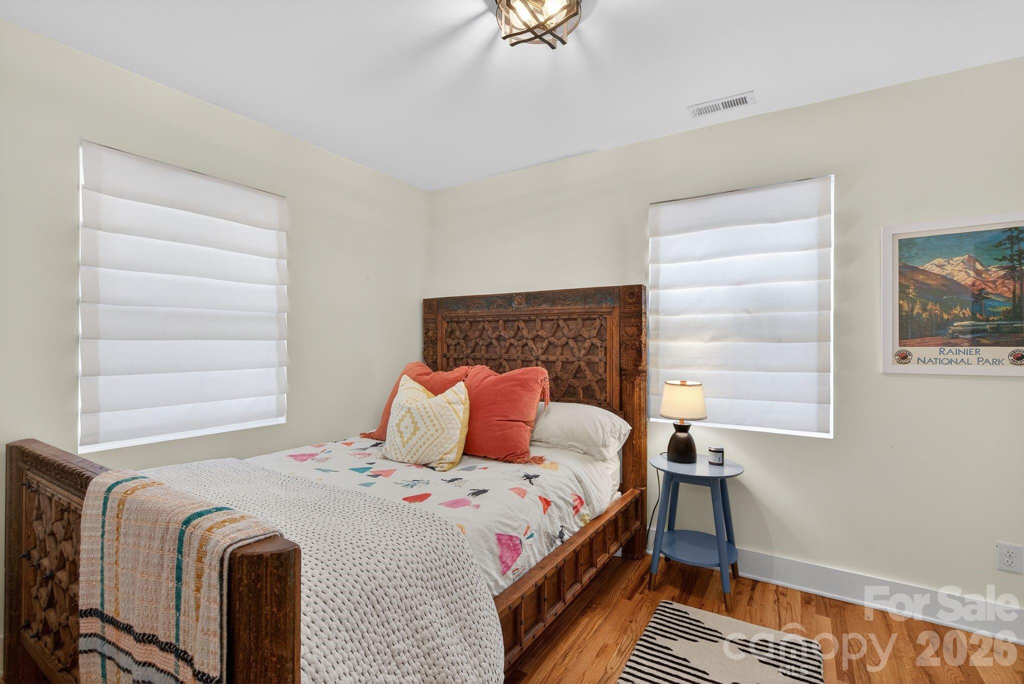 20 Bethesda Road Asheville, NC 28805 - Photo 21 of 30 a bedroom with a bed and a window