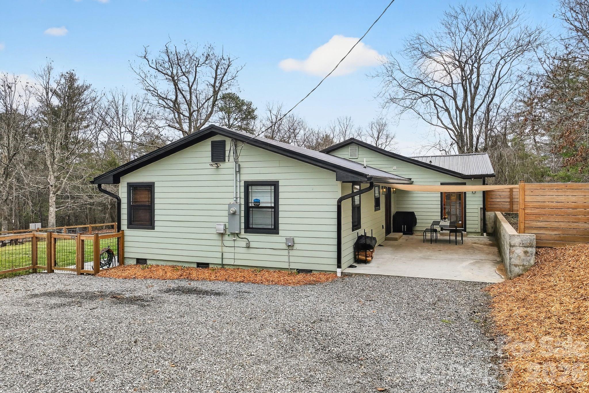 20 Bethesda Road Asheville, NC 28805 - Photo 24 of 30 a view of a house with a yard and large tree