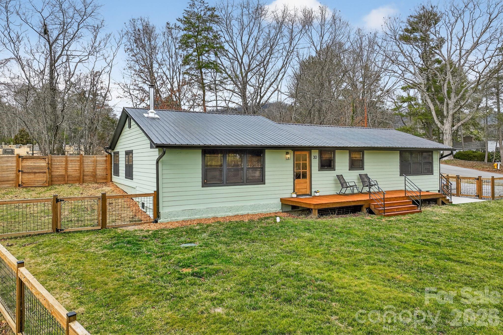 20 Bethesda Road Asheville, NC 28805 - Photo 25 of 30 a front view of a house with a garden and trees