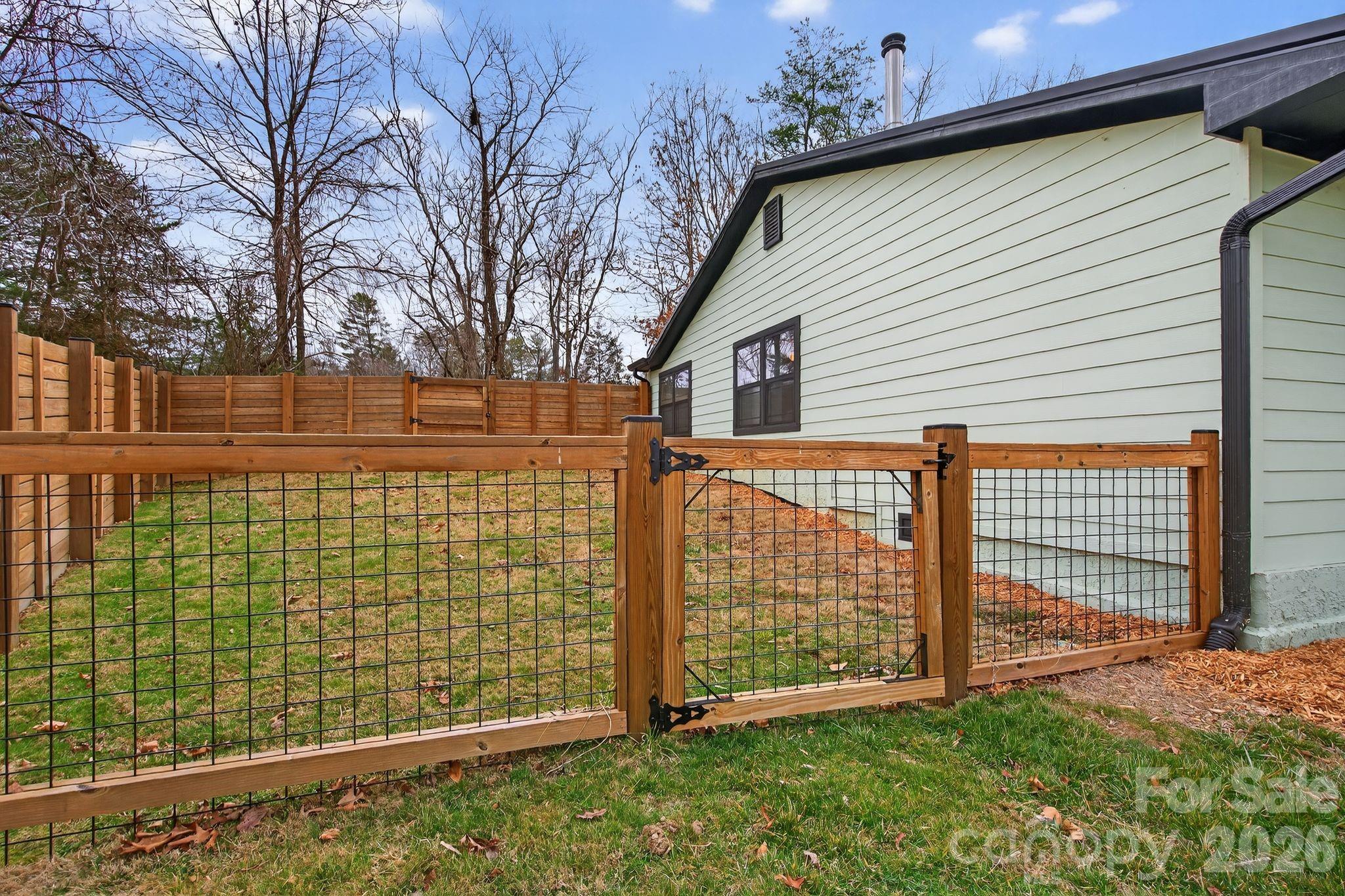 20 Bethesda Road Asheville, NC 28805 - Photo 27 of 30 a front view of a house with a garden