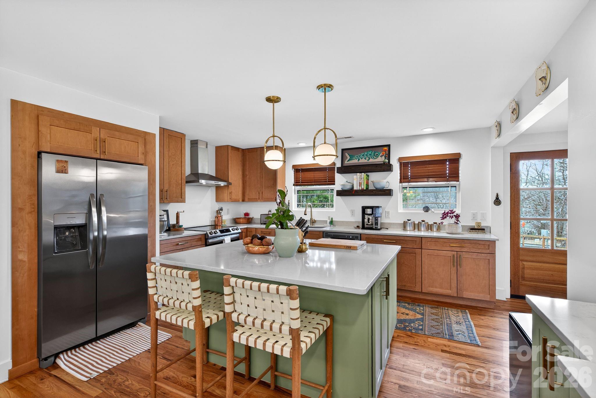 20 Bethesda Road Asheville, NC 28805 - Photo 3 of 30 a kitchen with stainless steel appliances a sink stove and refrigerator