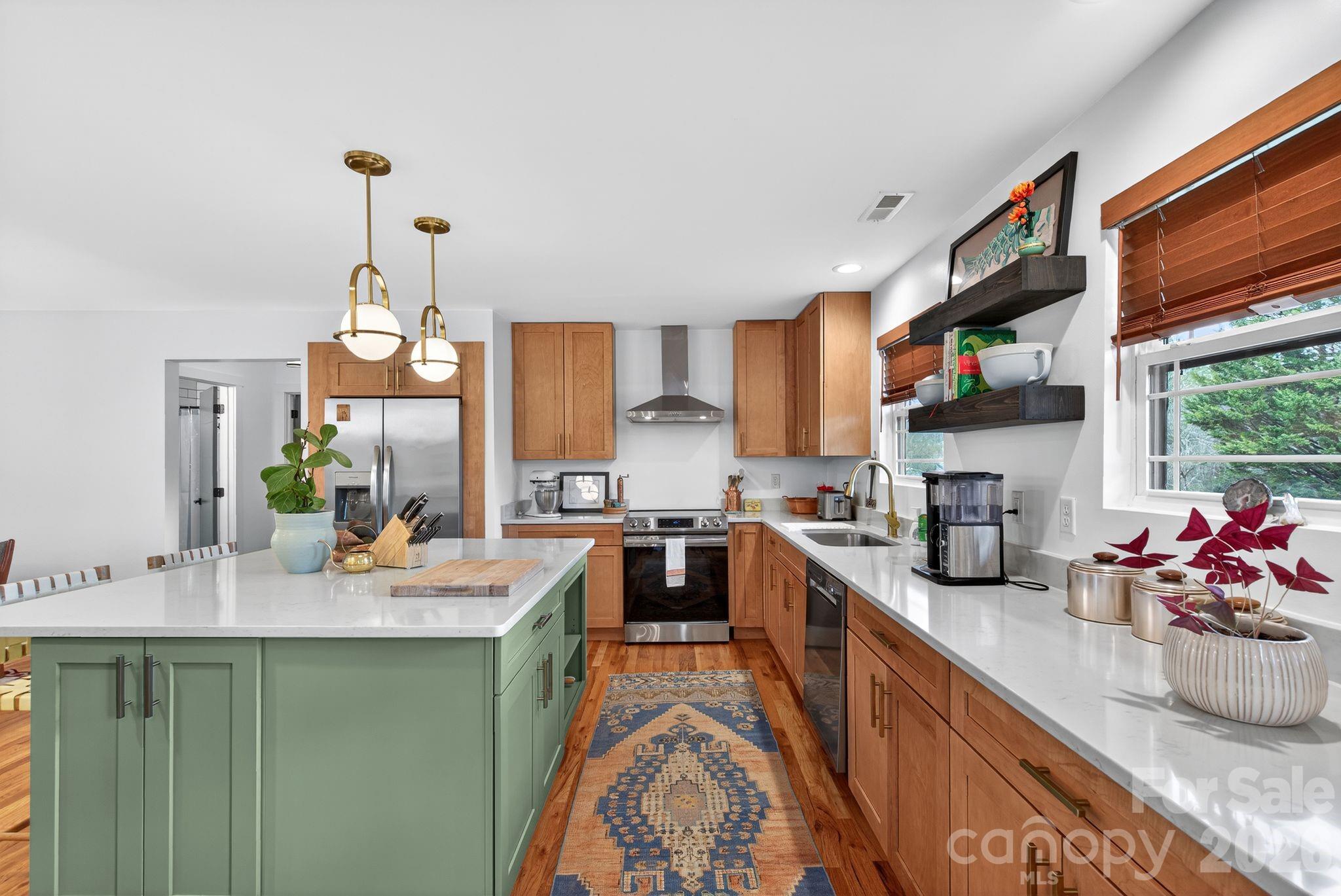 20 Bethesda Road Asheville, NC 28805 - Photo 7 of 30 a large kitchen with a lot of counter space and wooden floor