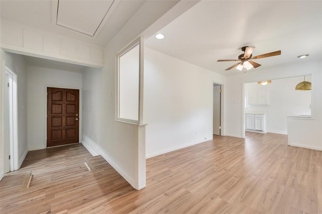 1104 Trinity View Street Irving, TX 75060 - Photo 24 of 34 an empty room with wooden floor and ceiling fan