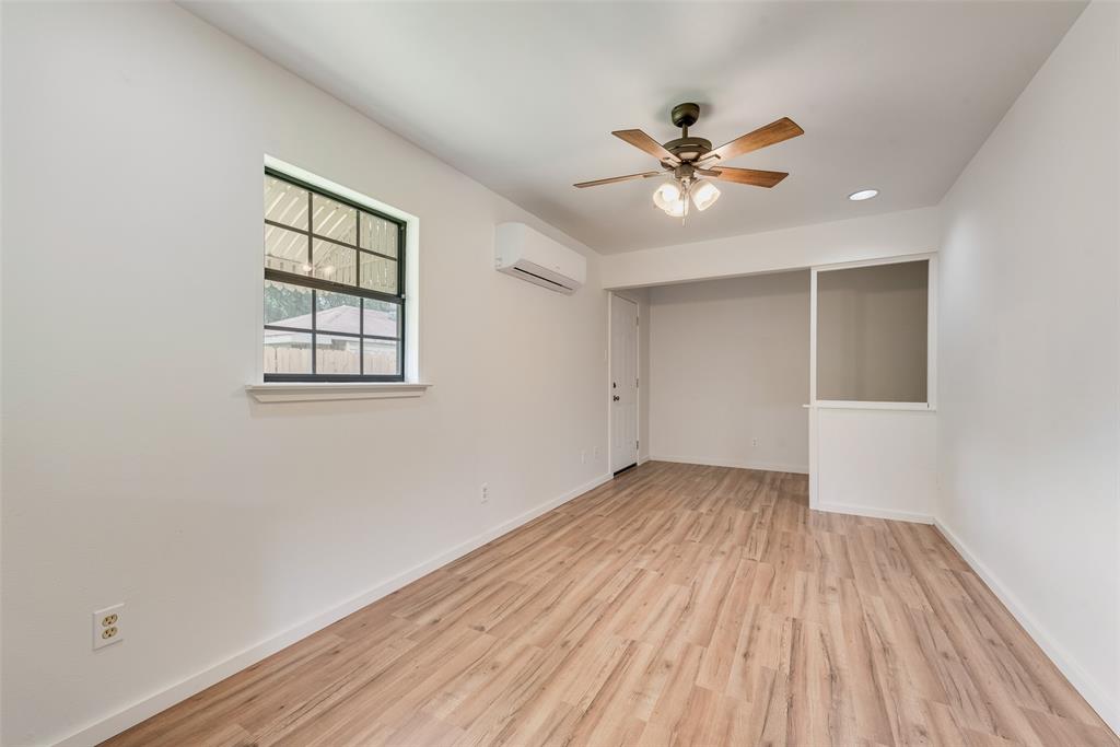 1104 Trinity View Street Irving, TX 75060 - Photo 26 of 34 a view of an empty room with wooden floor and a window