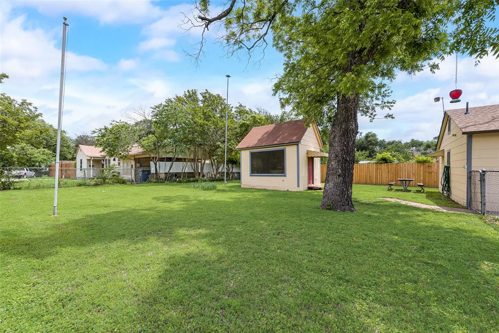 1104 Trinity View Street Irving, TX 75060 - Photo 33 of 34 a view of a house with backyard and a tree