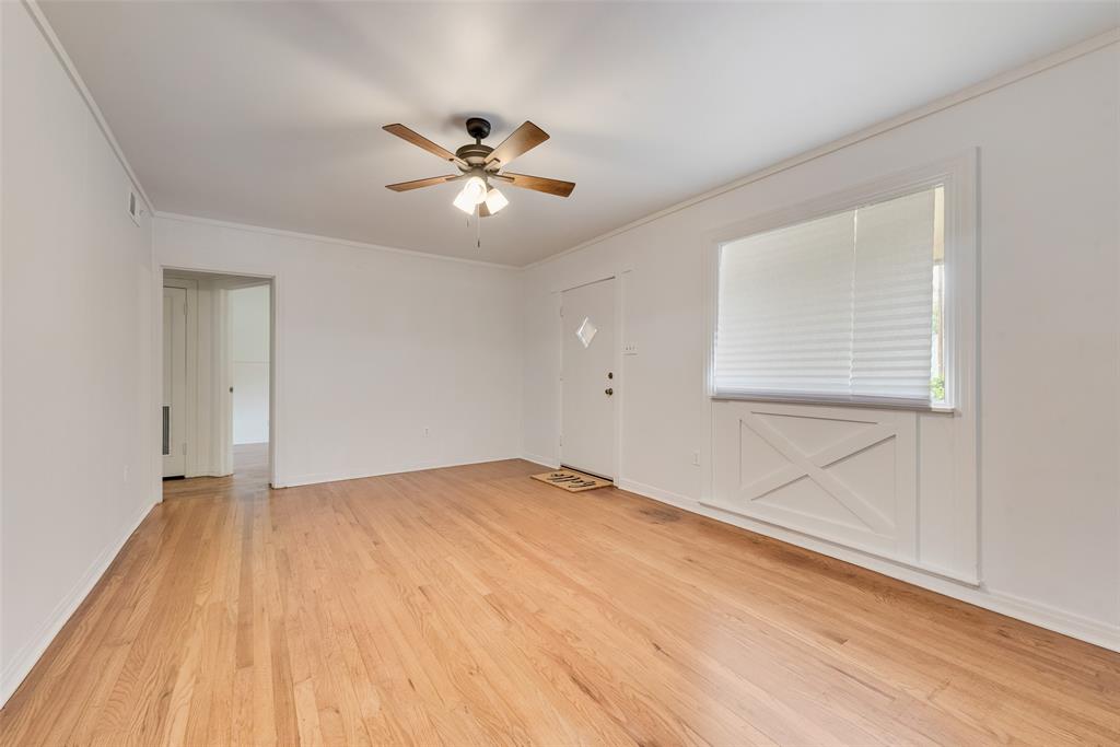 1104 Trinity View Street Irving, TX 75060 - Photo 7 of 34 a view of empty room with wooden floor and fan