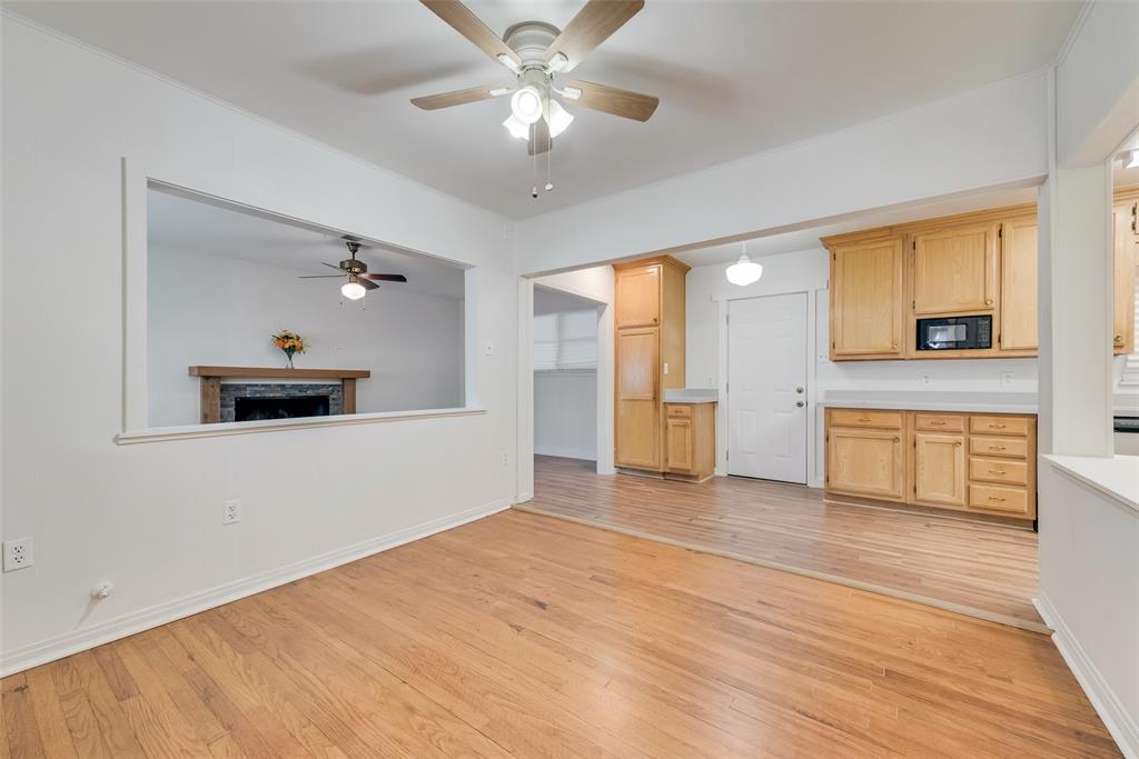 1104 Trinity View Street Irving, TX 75060 - Photo 8 of 34 a view of empty room with wooden floor and fan