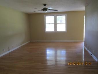 1682 Lock B Road North Clarksville, TN 37043 - Photo 2 of 10 a view of empty room with wooden floor and fan