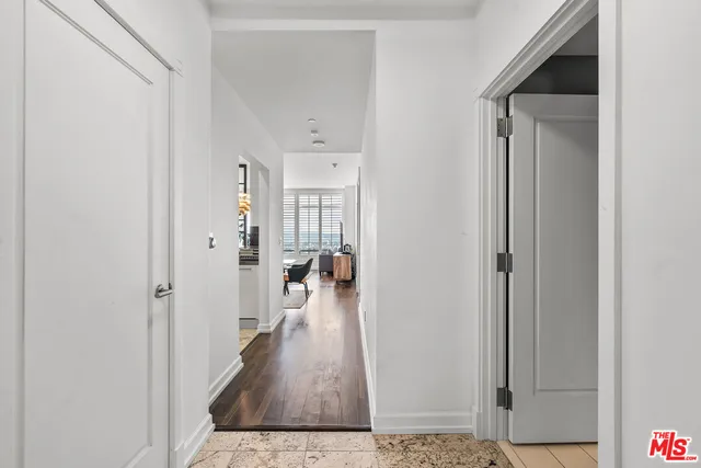 a bathroom with a tub sink vanity and toilet