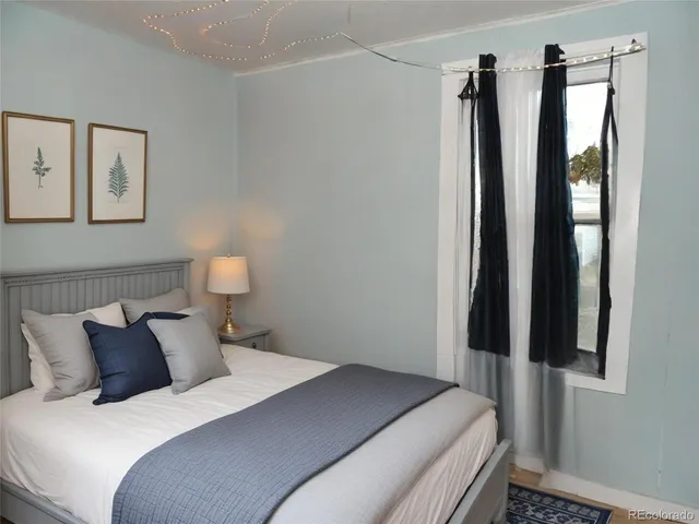 a bedroom with a bed and a table in it