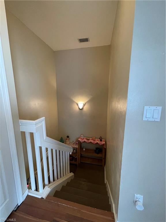 14908 Summit Pl Circle, Unit 26 Naples, FL 34119 - Photo 24 of 32 a view of livingroom with furniture and staircase