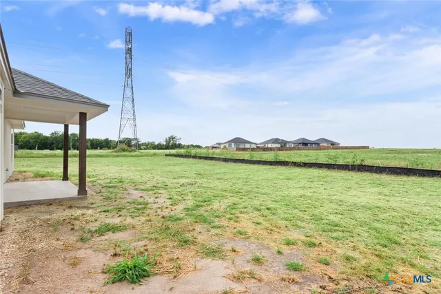 a view of a water with palm trees