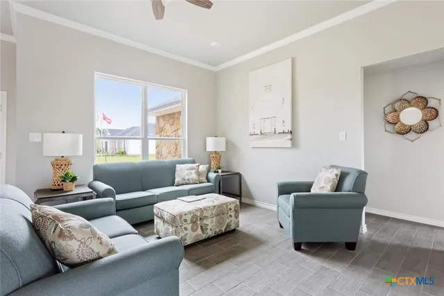 a living room with furniture and a window