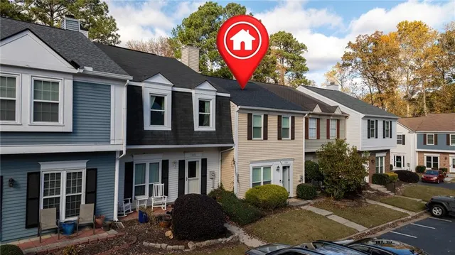 a view of a brick building with many windows