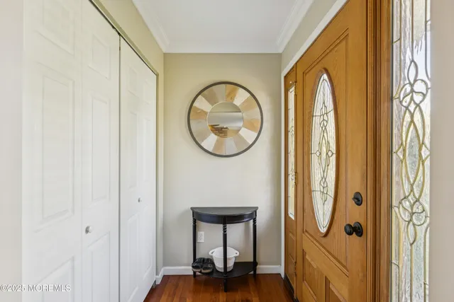 a view of a room with a mirror and a window