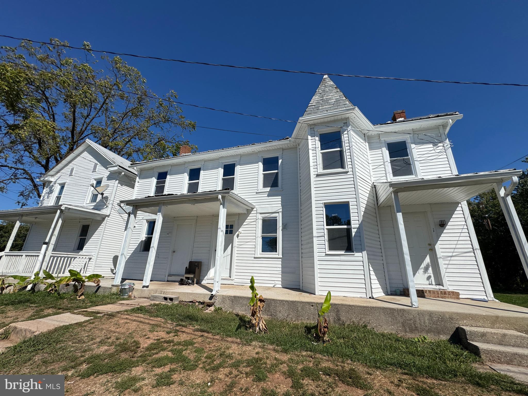 3754 Baltimore Pike, Unit 2 Littlestown, PA 17340 - Photo 1 of 24 a front view of a house with garden