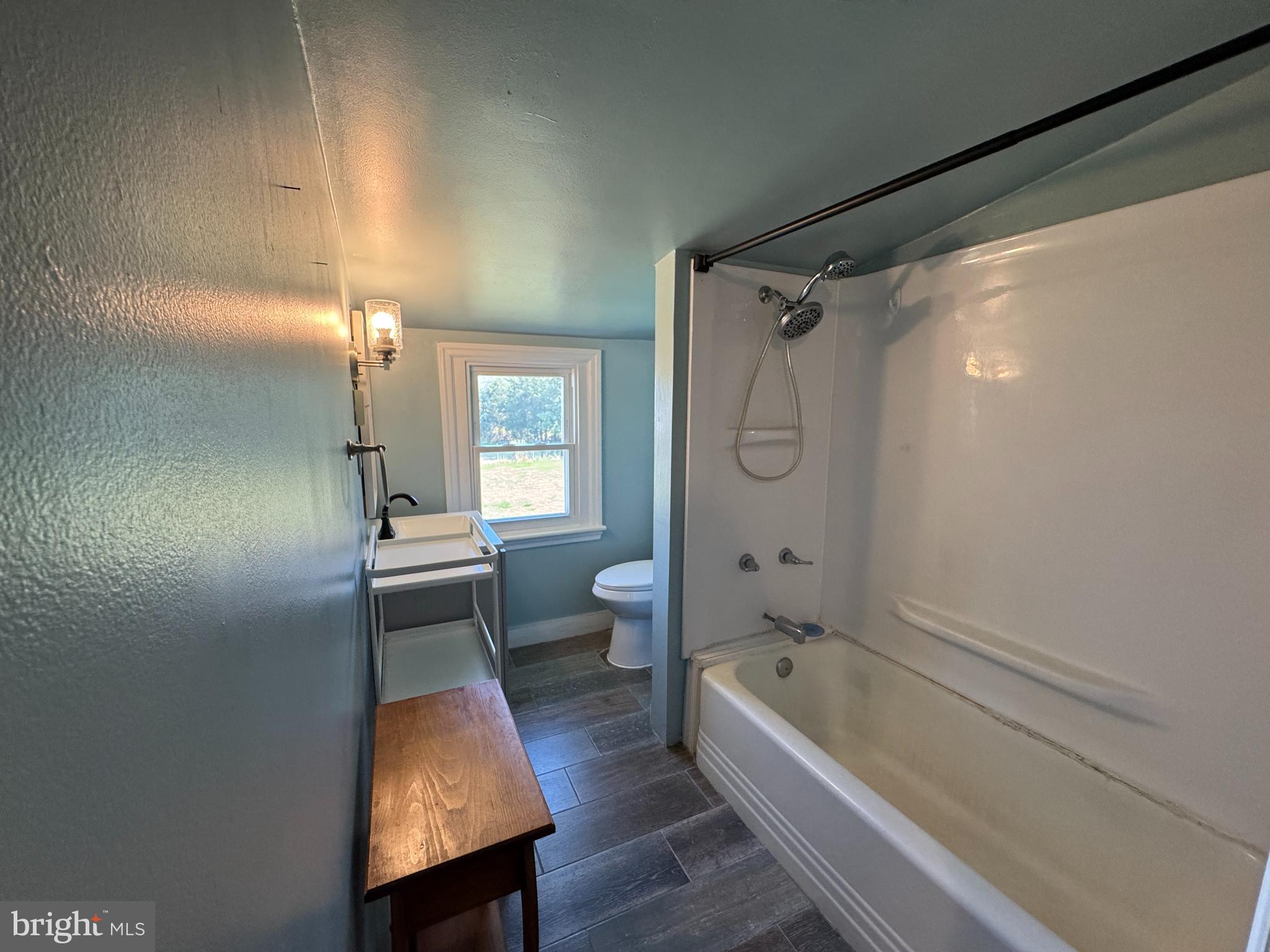 3754 Baltimore Pike, Unit 2 Littlestown, PA 17340 - Photo 17 of 24 a bathroom with a bathtub shower sink and toilet