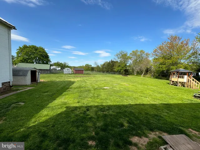 a view of a big yard with a house