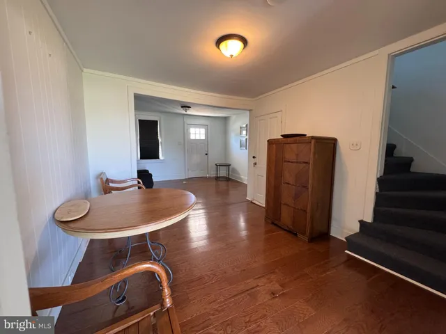 a room with furniture and wooden floors