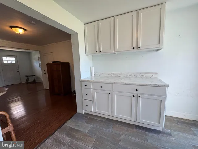 a kitchen with stainless steel appliances granite countertop a refrigerator sink and cabinets