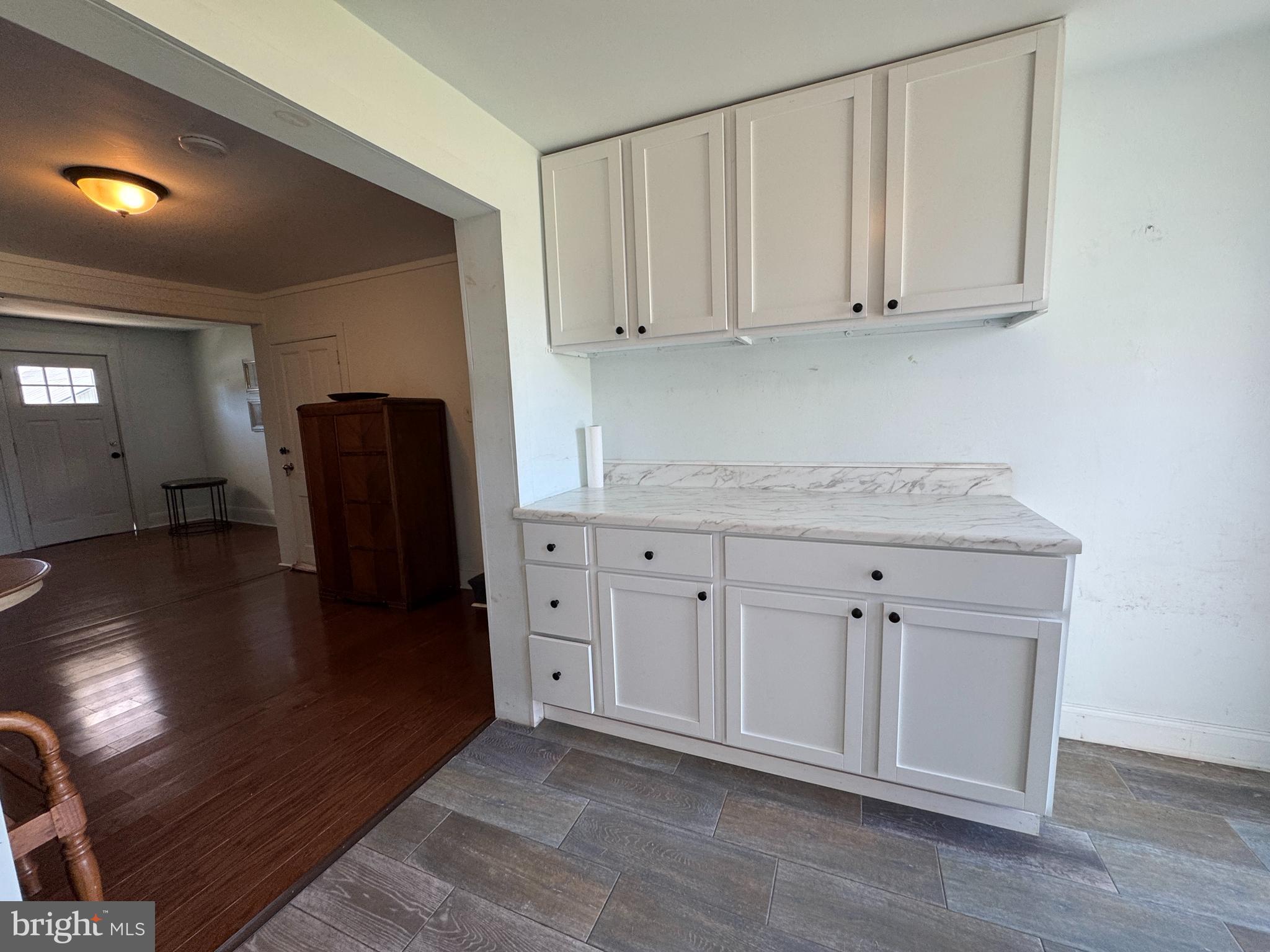 3754 Baltimore Pike, Unit 2 Littlestown, PA 17340 - Photo 9 of 24 a kitchen with stainless steel appliances granite countertop a refrigerator sink and cabinets