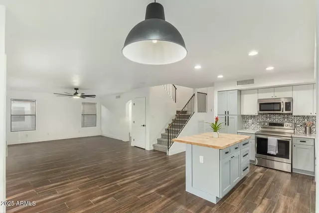 a kitchen with a sink and a stove