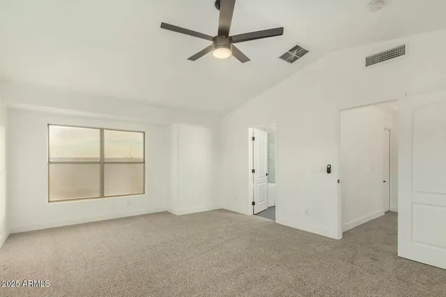 a view of an empty room with a window