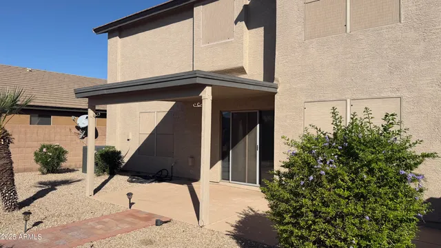 a view of a back yard of the house