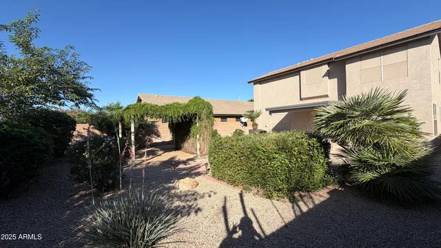 a view of a backyard of the house