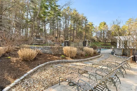 a view of a backyard of white house