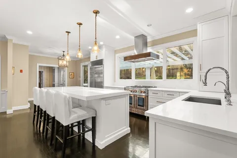 a kitchen that has a lot of cabinets in it