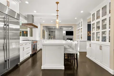 a bathroom with a sink a washer and dryer