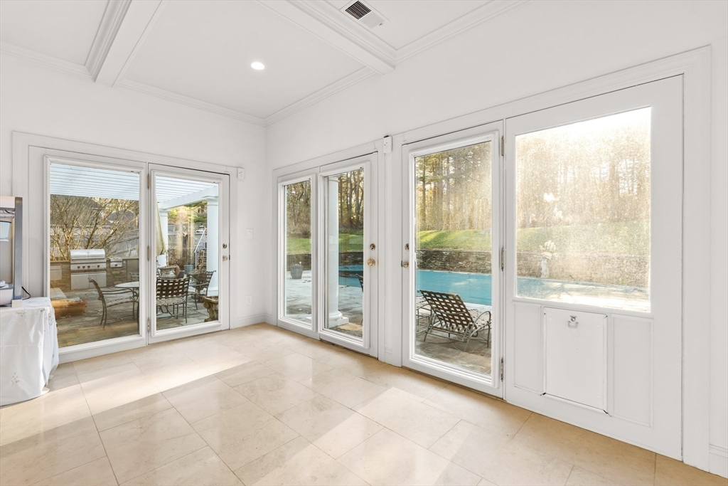 20 Burr Drive Needham, MA 02492 - Photo 10 of 19 a view of an empty room with glass door and a window