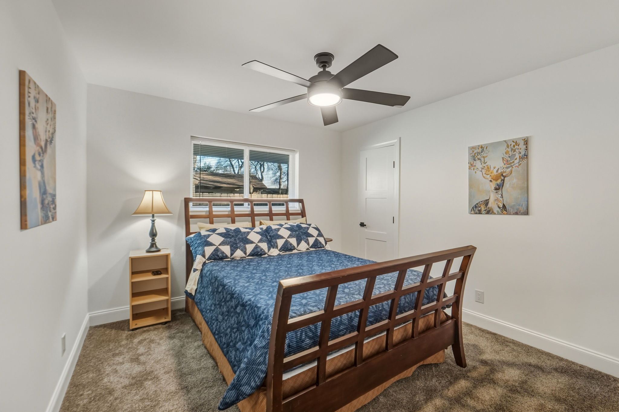 2107 Lewood Circle Austin, TX 78745 - Photo 14 of 30 Bedroom with ceiling fan and dark carpet