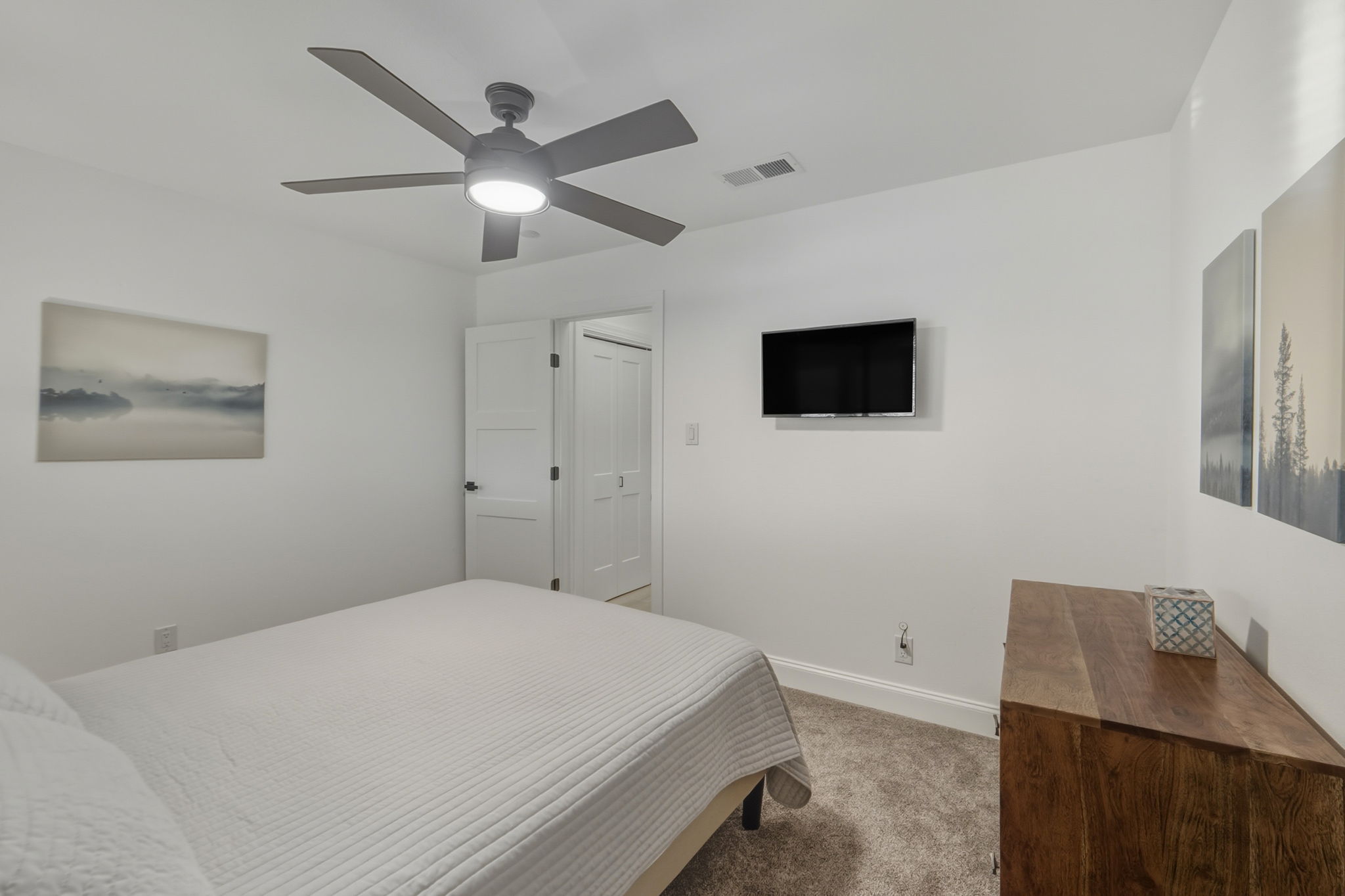 2107 Lewood Circle Austin, TX 78745 - Photo 16 of 30 Bedroom featuring light colored carpet and ceiling fan