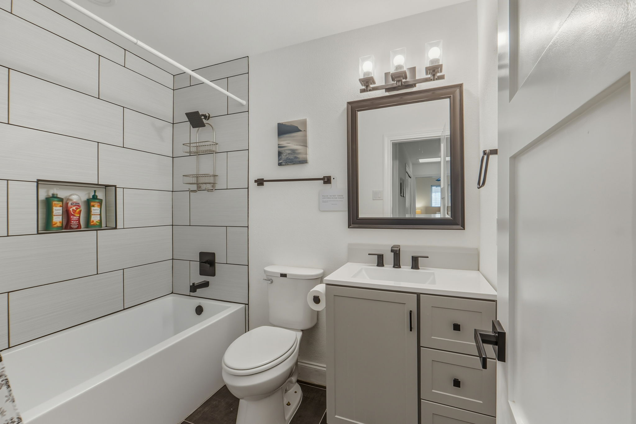 2107 Lewood Circle Austin, TX 78745 - Photo 17 of 30 Full bathroom featuring vanity and shower / washtub combination