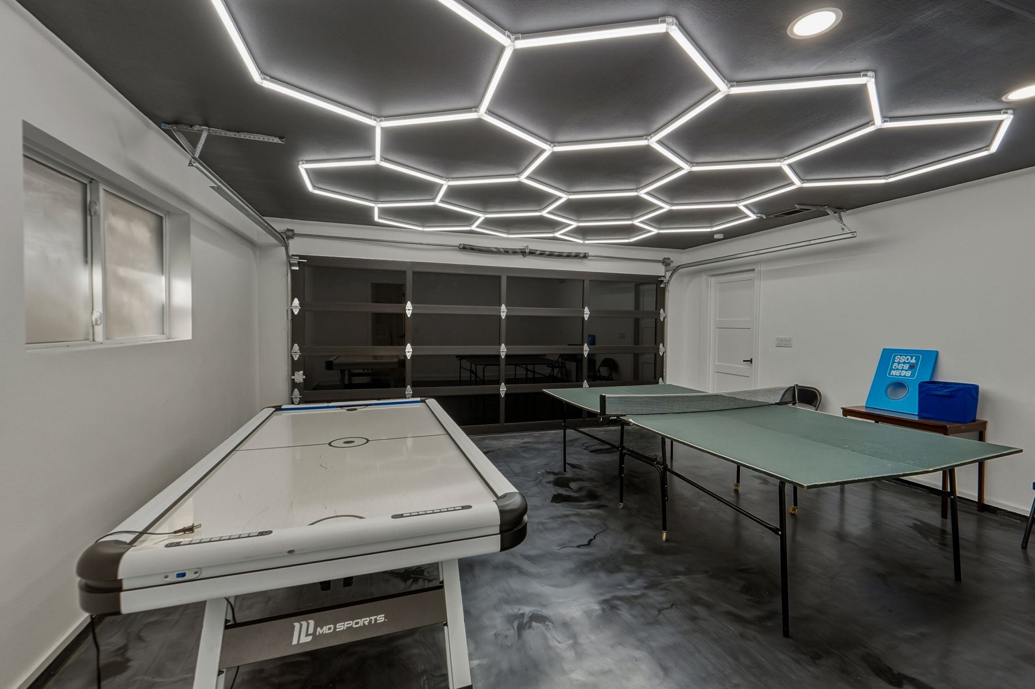 2107 Lewood Circle Austin, TX 78745 - Photo 19 of 30 Rec room with finished concrete flooring and a garage