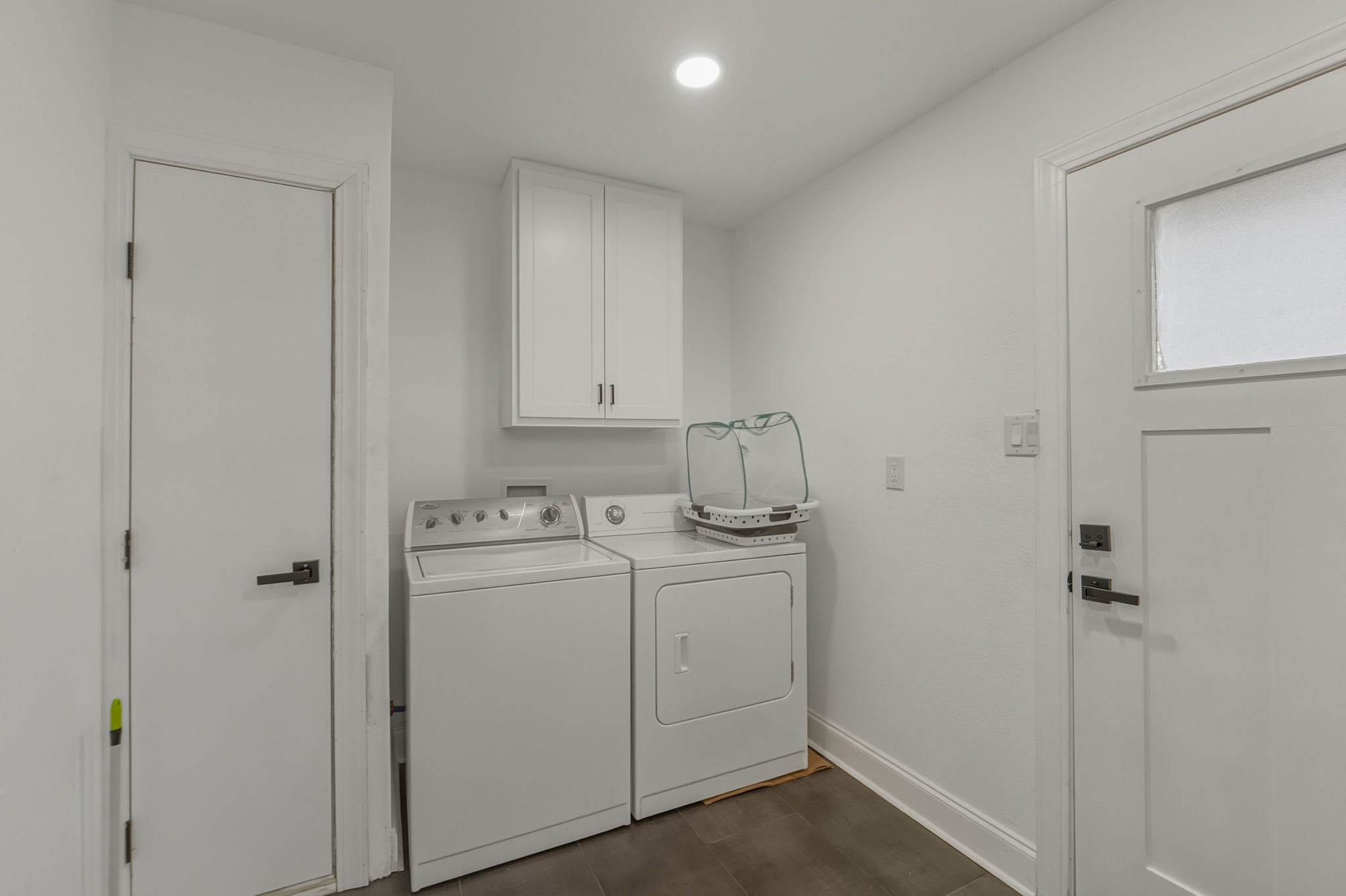 2107 Lewood Circle Austin, TX 78745 - Photo 20 of 30 Laundry area featuring independent washer and dryer, cabinet space, and recessed lighting