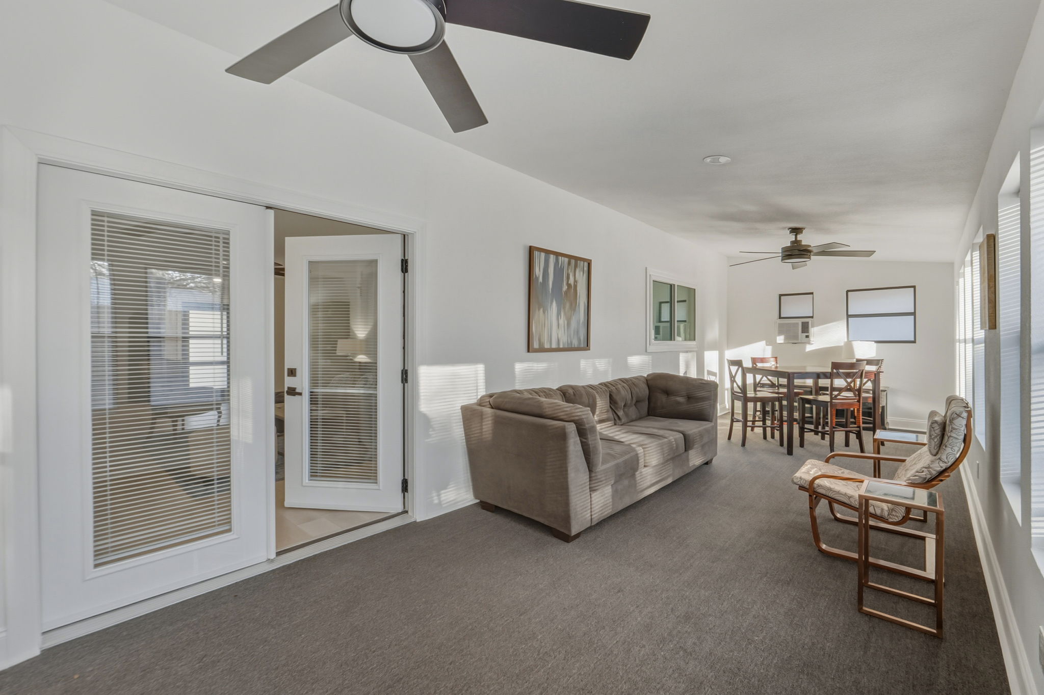 2107 Lewood Circle Austin, TX 78745 - Photo 21 of 30 Carpeted living area featuring a ceiling fan and lofted ceiling