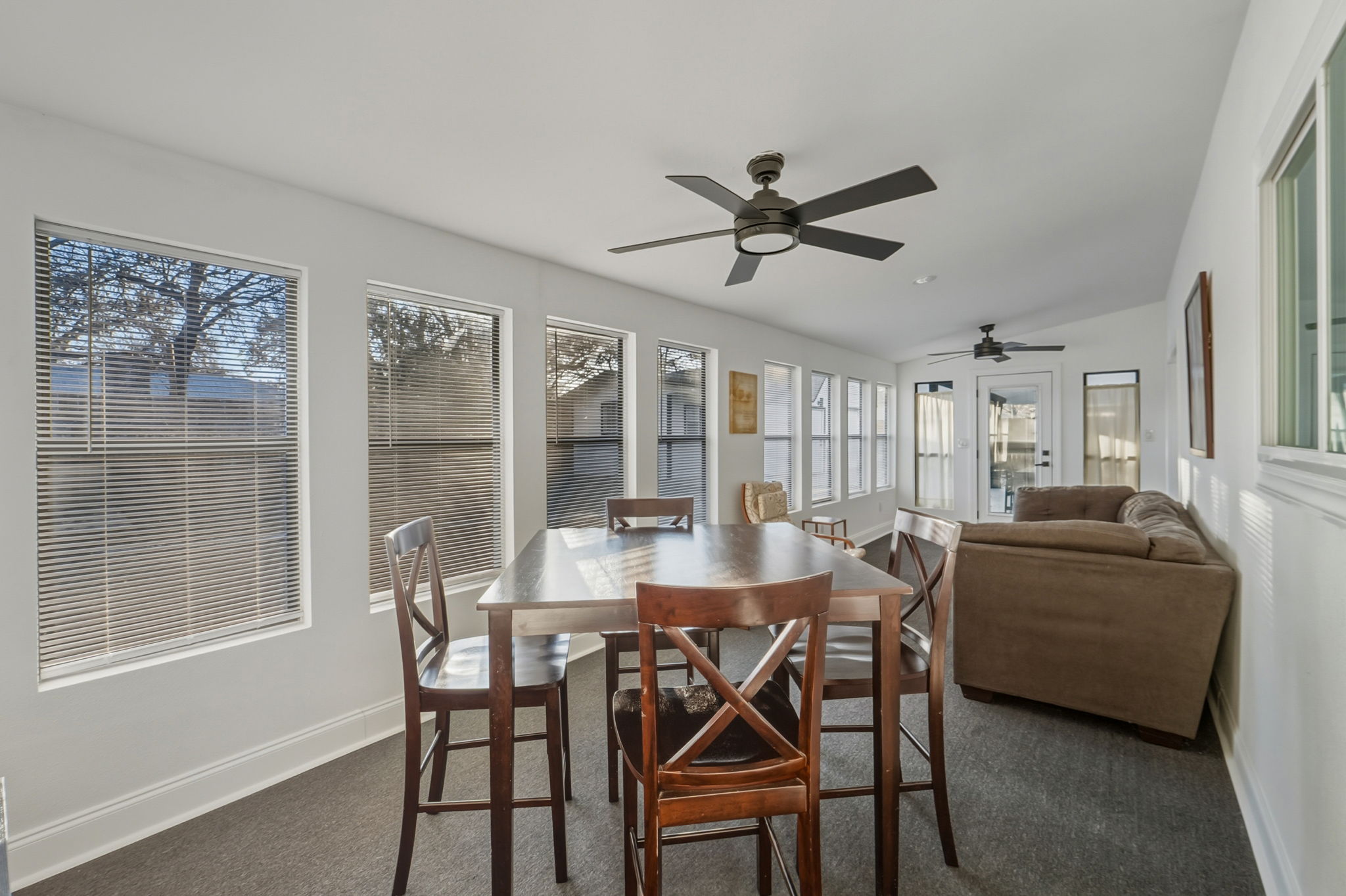 2107 Lewood Circle Austin, TX 78745 - Photo 22 of 30 Dining area featuring dark colored carpet and a ceiling fan