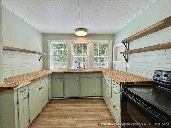a kitchen with a stove and a sink