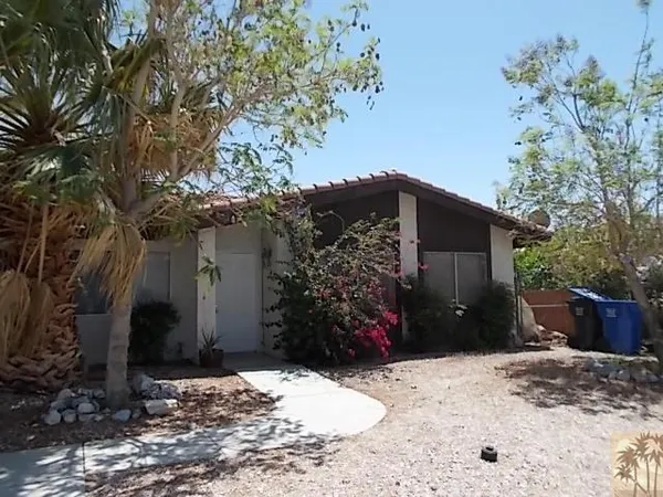 a view of a backyard of the house