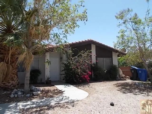 a view of a backyard of the house