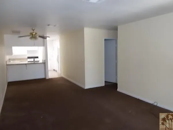 a view of a kitchen with a sink dishwasher and a fireplace