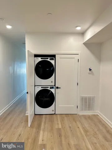 a view of a hallway with washer and dryer