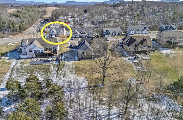a view of a swimming pool with a backyard of the house